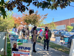 Franca Muller Paz, Green Party candidate for District 12 council in Baltimore City, talks with voters at Barclay Elementary/Middle School. Photo by Elizabeth Shwe