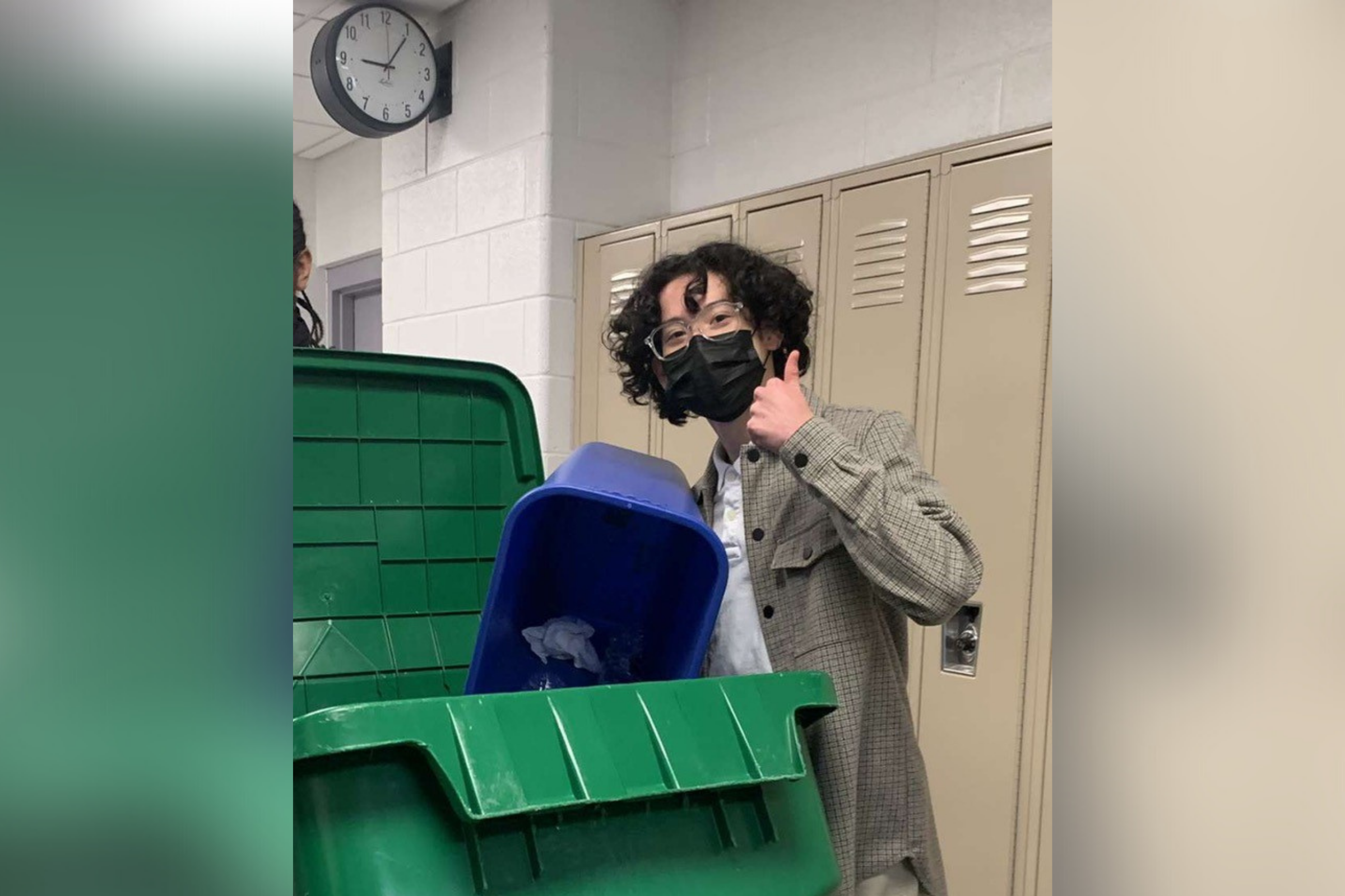 student javier fuentes handles waste bins at school