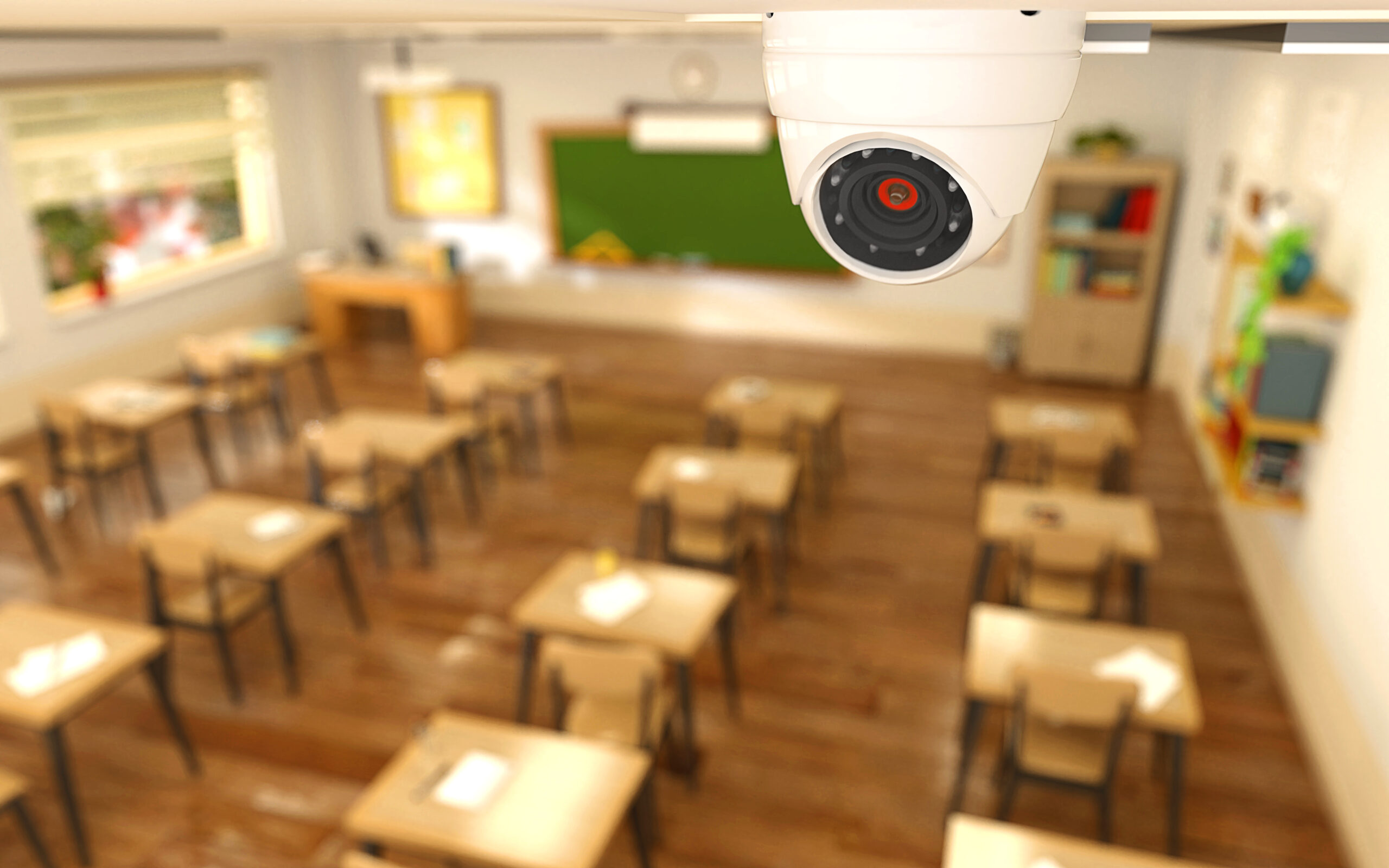 rendering of a small camera on the ceiling of an empty classroom
