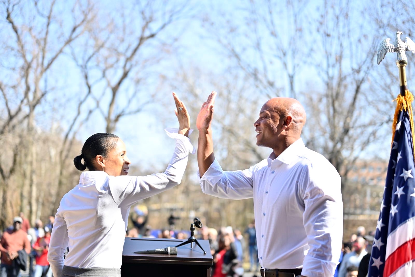 Angela Alsobrooks high-fives Wes Moore on a campaign stage