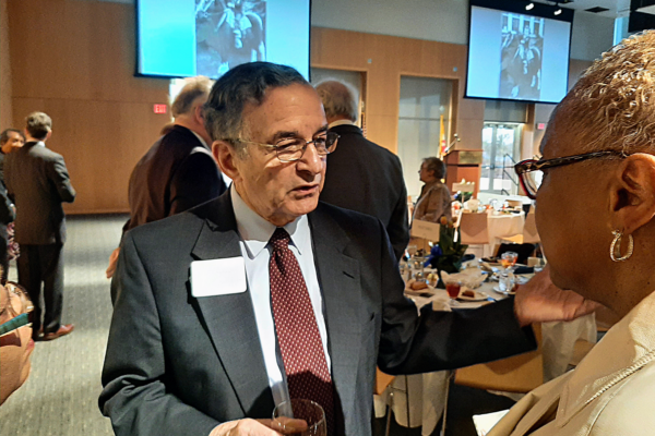 Tony Sarbanes speaks with visitors to dinner honoring his late brother