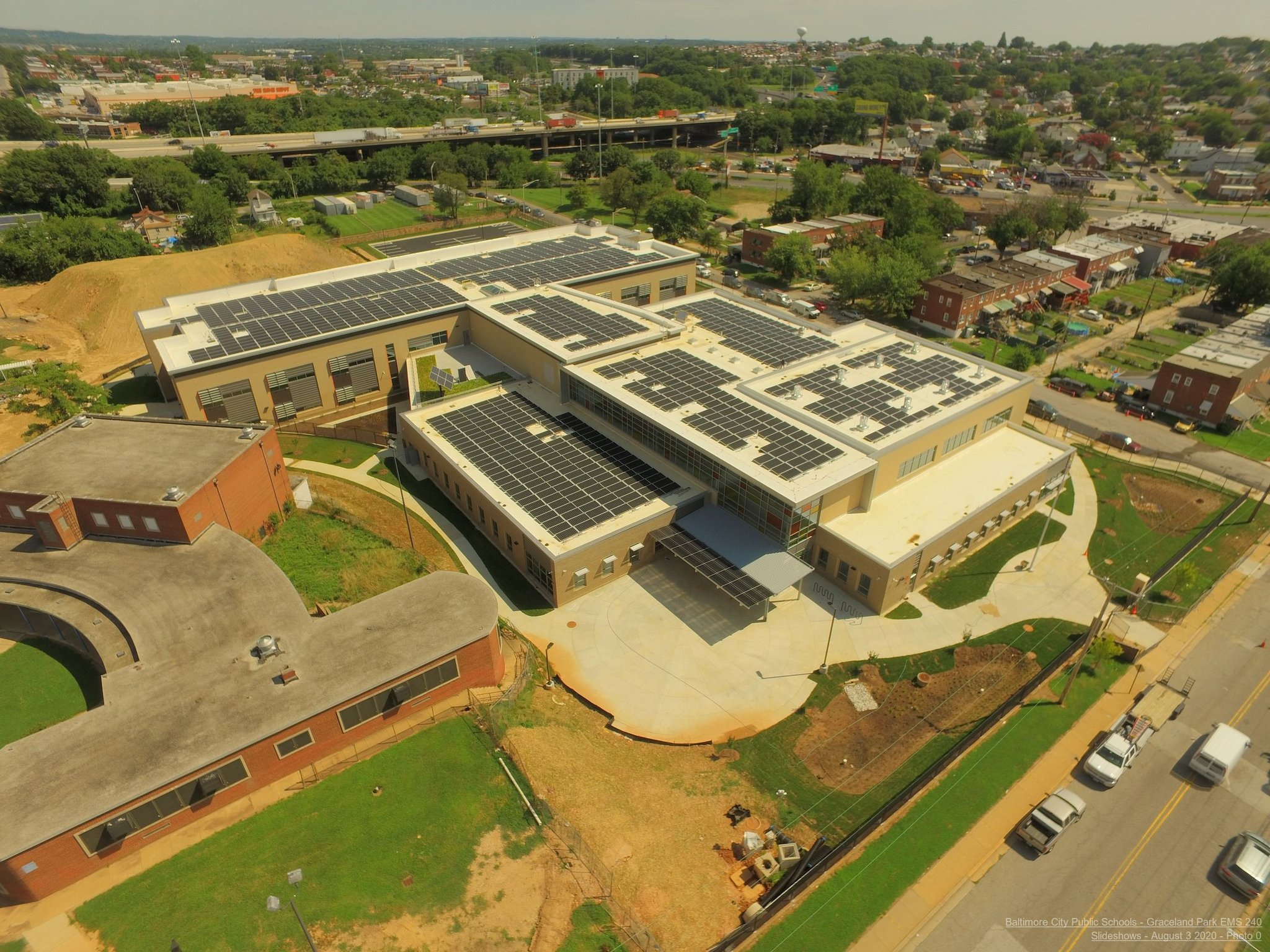 An aerial photo of the new Graceland Park-O'Donnell Heights Elementary and Middle School in Baltimore showing solar panels on the rooftop